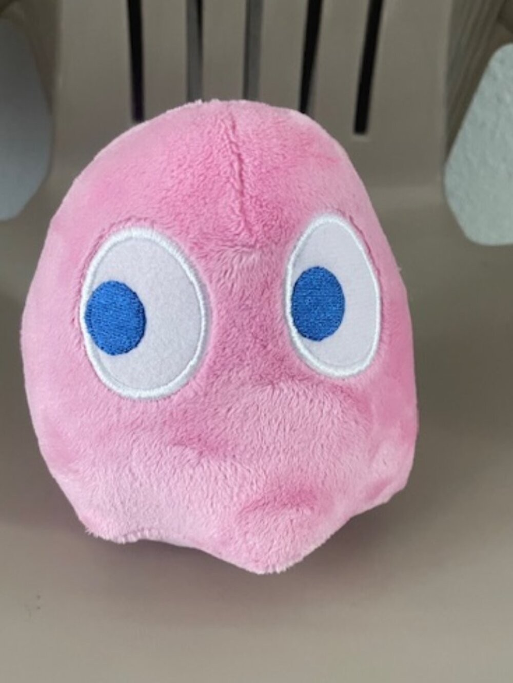 Pinky, the bubblegum-pink ghost from the classic arcade game Pac-Man